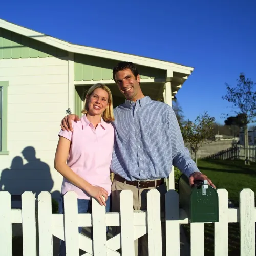 Couple Outside New Home