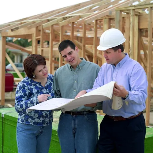 Couple looking at house blueprints